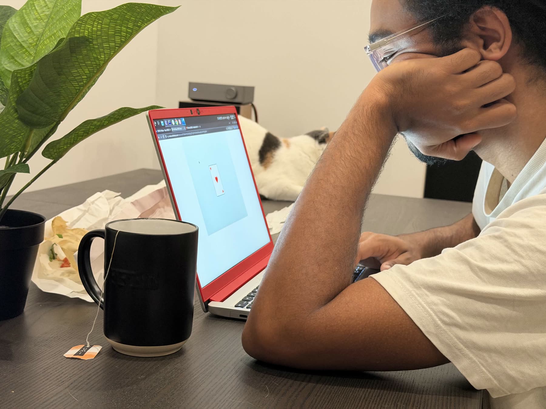 A person sitting at a laptop while taking the ADHD exam.